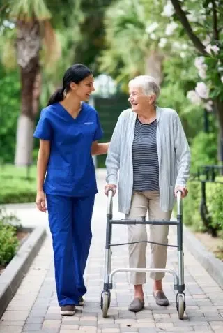 Emmucare Franchise Caregiver & Client Walking