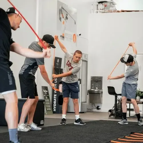 Tee Box Franchise students training their golf swing