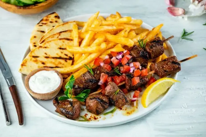 The Great Greek Mediterranean Franchise Lamb Kabob dish