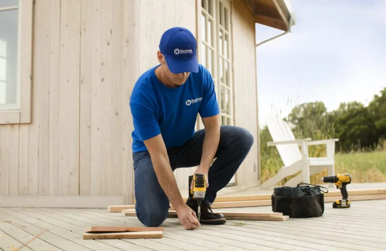 Handyman Connection employee installing a deck.