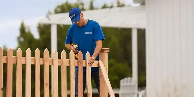 Handyman Connection handyman repairing a fence